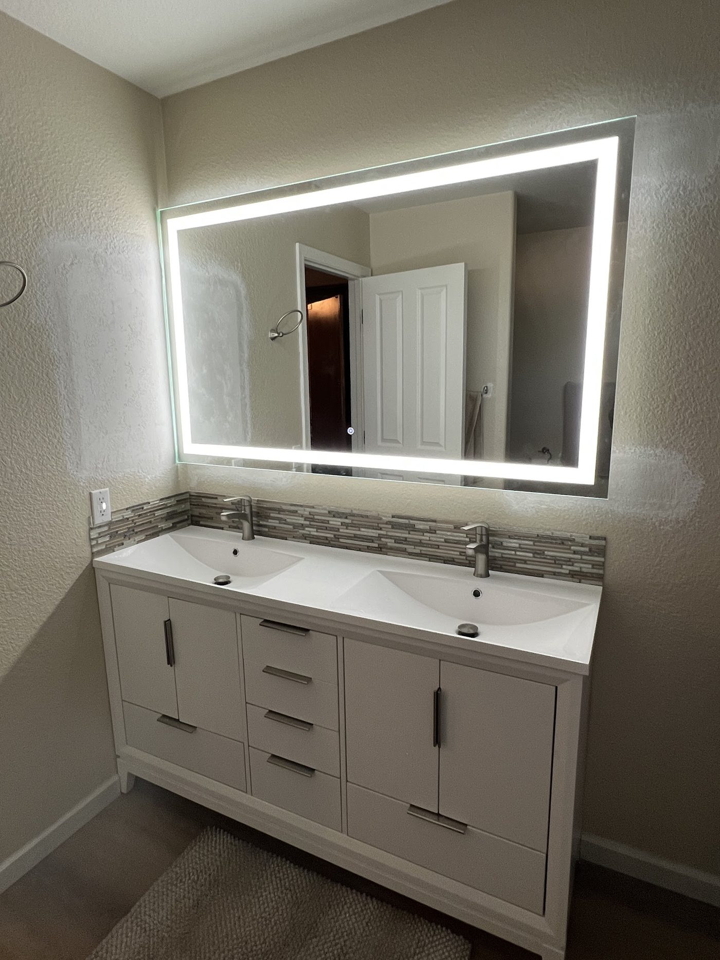 Finished double vanity with backlit LED mirror