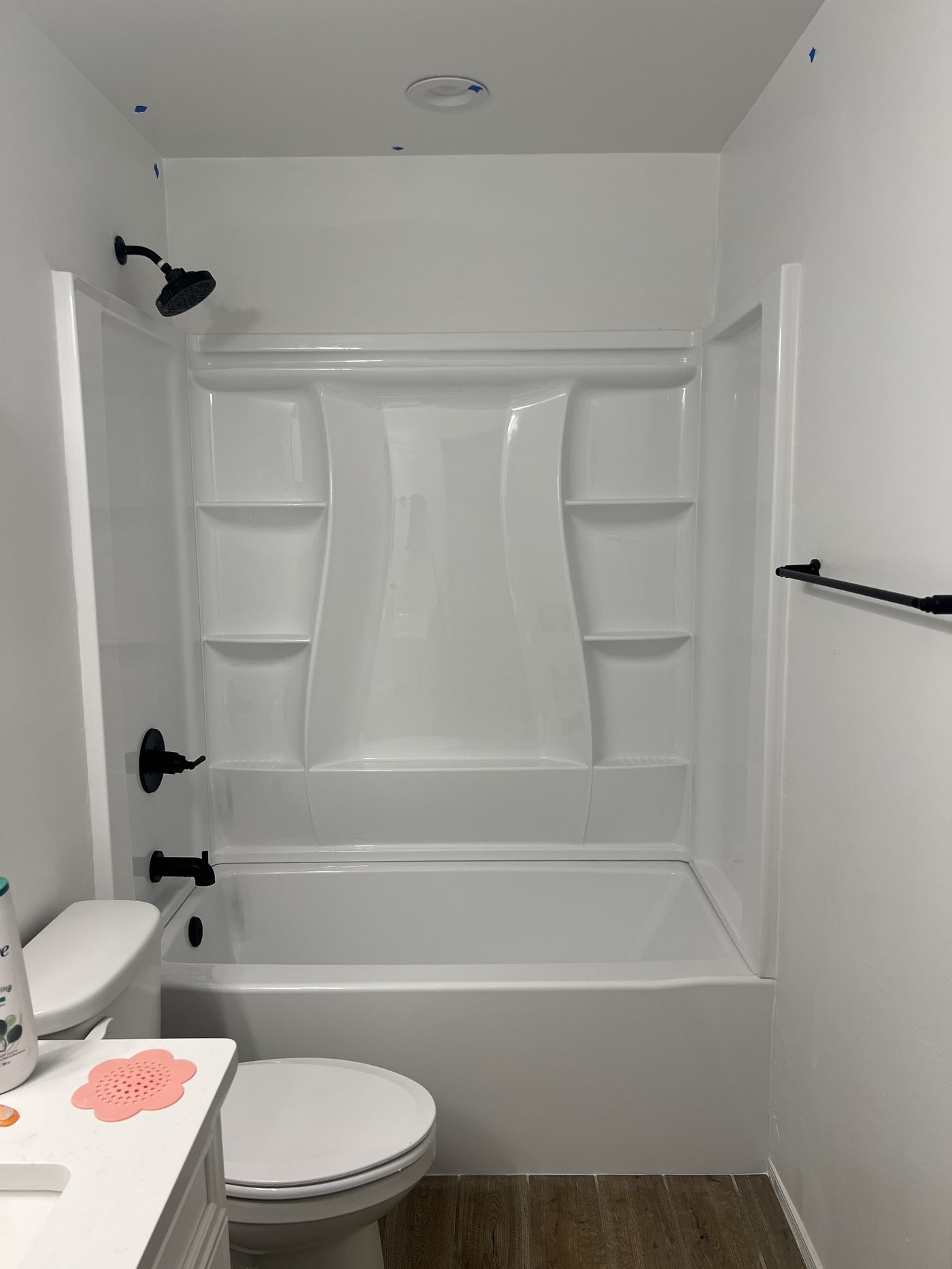 Finished one-piece tub and shower surround